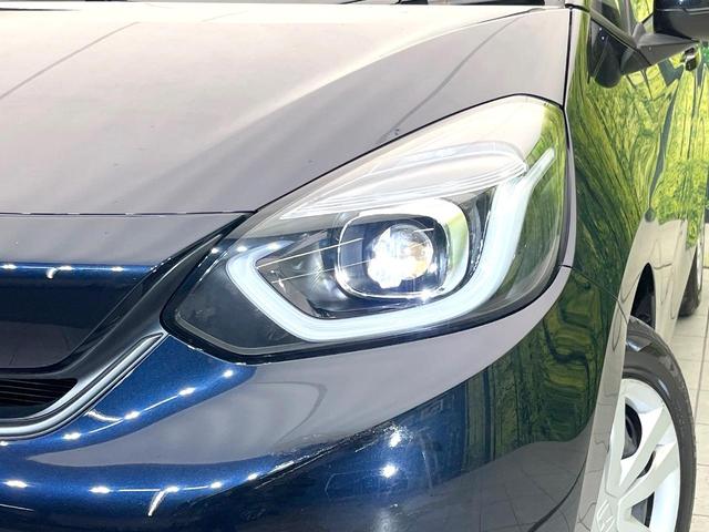 フィット ホーム 禁煙車 純正SDナビ ホンダセンシング レーダークルーズ バックカメラ オートエアコン ドラレコ ETC スマートキー ハーフレザーシート LEDヘッドライト オートマチックハイビーム 電動格納ミラー(12枚目)