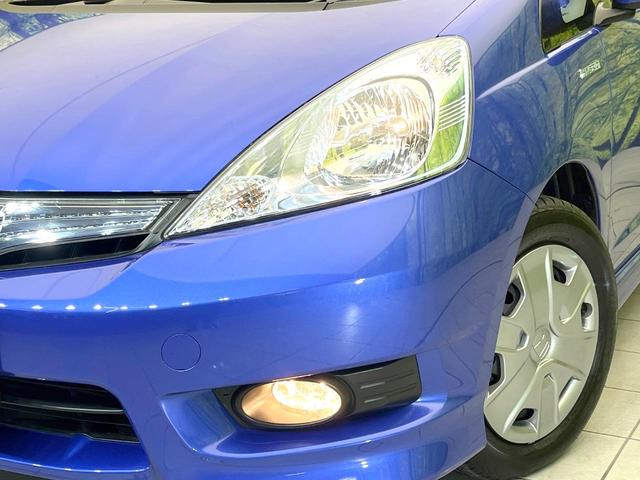 フィットシャトルハイブリッド ハイブリッド　禁煙車　純正ナビ　バックモニター　クルコン　ＥＴＣ　ドラレコ　リモコンキー　オートエアコン　ハーフレザーシート　シートリフター　電動格納ミラー　ヘッドライトレベライザー　バニティミラー（12枚目）