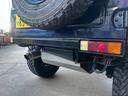 　リフトアップ　２２５／７５Ｒ１６タイヤ　前後社外バンパー　社外グリル　社外マフラー　モモステアリング　天井張替え　シートカバー　ターボ　４ＷＤ切替式　ＡＴ（23枚目）