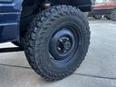 　リフトアップ　２２５／７５Ｒ１６タイヤ　前後社外バンパー　社外グリル　社外マフラー　モモステアリング　天井張替え　シートカバー　ターボ　４ＷＤ切替式　ＡＴ（59枚目）