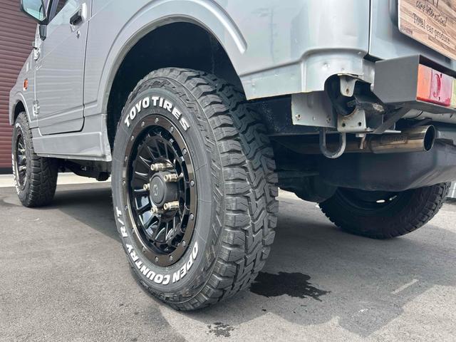 ジムニー 　禁煙車　茶色シートカバー　社外１６インチＡＷ　４ＷＤ　ＥＴＣ　ＡＴ　ＣＤ　アルミホイール　エアコン（48枚目）