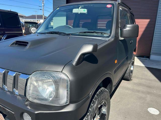 ジムニー ワイルドウインド　４ＷＤ　ルーフレール　レイズ１６インチホイール　マットブラック塗装　社外ＴＯＴＳＵＧＥＫＩマフラー　社外ＲＯＡＤＷＩＮラテラルロッド　シートヒーター　社外ナビ　ＥＴＣ　スペアキー（7枚目）