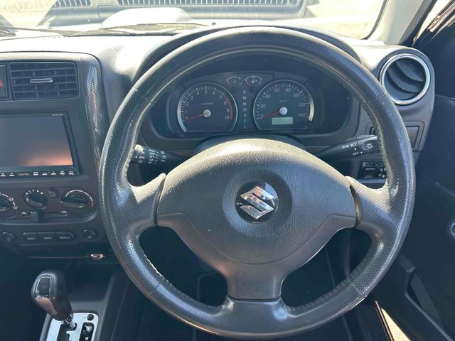 ジムニー ワイルドウインド　４ＷＤ　ルーフレール　レイズ１６インチホイール　マットブラック塗装　社外ＴＯＴＳＵＧＥＫＩマフラー　社外ＲＯＡＤＷＩＮラテラルロッド　シートヒーター　社外ナビ　ＥＴＣ　スペアキー（11枚目）