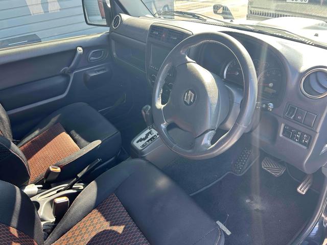 ジムニー ワイルドウインド　４ＷＤ　ルーフレール　レイズ１６インチホイール　マットブラック塗装　社外ＴＯＴＳＵＧＥＫＩマフラー　社外ＲＯＡＤＷＩＮラテラルロッド　シートヒーター　社外ナビ　ＥＴＣ　スペアキー（12枚目）