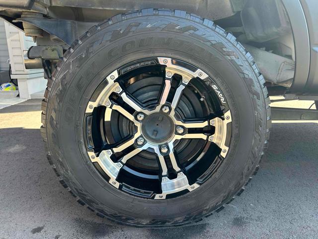 ジムニー ワイルドウインド　４ＷＤ　ルーフレール　レイズ１６インチホイール　マットブラック塗装　社外ＴＯＴＳＵＧＥＫＩマフラー　社外ＲＯＡＤＷＩＮラテラルロッド　シートヒーター　社外ナビ　ＥＴＣ　スペアキー（26枚目）