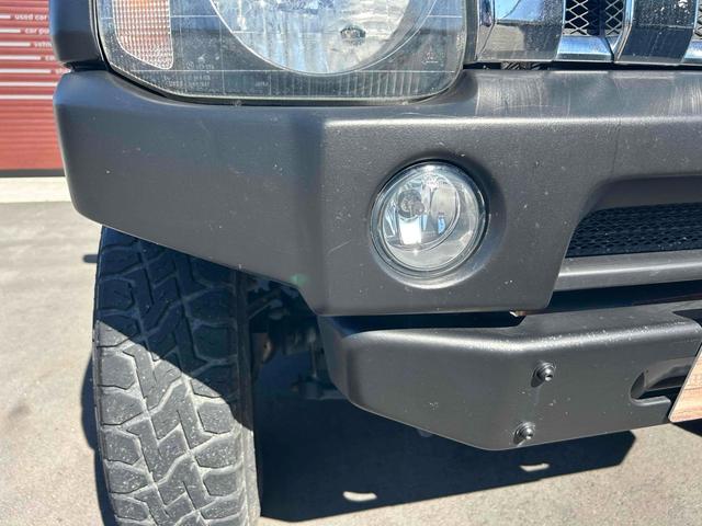 ジムニー ワイルドウインド　４ＷＤ　ルーフレール　レイズ１６インチホイール　マットブラック塗装　社外ＴＯＴＳＵＧＥＫＩマフラー　社外ＲＯＡＤＷＩＮラテラルロッド　シートヒーター　社外ナビ　ＥＴＣ　スペアキー（30枚目）