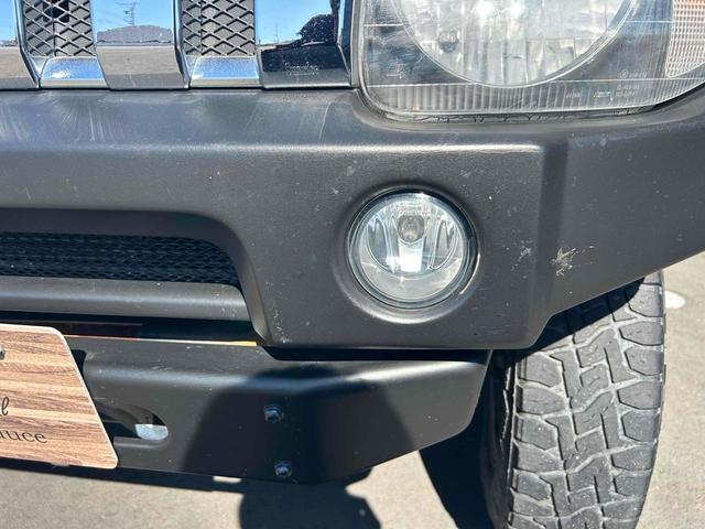 ジムニー ワイルドウインド　４ＷＤ　ルーフレール　レイズ１６インチホイール　マットブラック塗装　社外ＴＯＴＳＵＧＥＫＩマフラー　社外ＲＯＡＤＷＩＮラテラルロッド　シートヒーター　社外ナビ　ＥＴＣ　スペアキー（40枚目）
