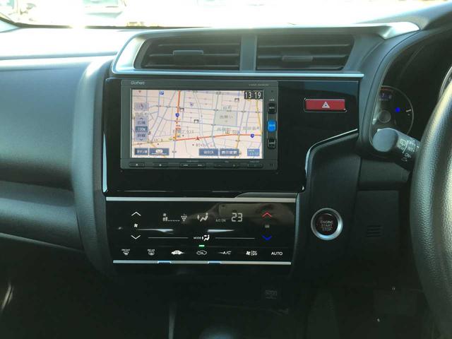 フィット １３Ｇ・Ｆパッケージ　スマートキー　アイドリングストップ　横滑防止　純正ナビＶＸＭ－１６４ＣＳｉ（ＣＤ／ＢＴオーディオ／ＡＭＦＭ／ワンセグ）　バックカメラ　ＥＴＣ　オートライト　オートミラー（22枚目）