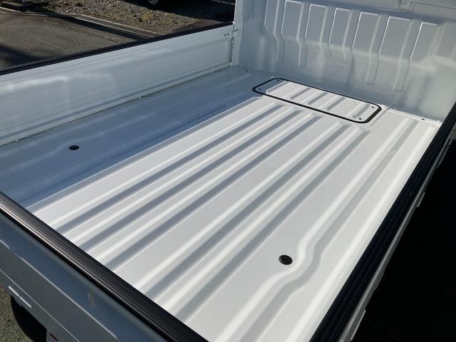 NT100クリッパートラック DX農繁仕様 4WD 5速マニュアル 届出済未使用車 デフロック 4枚スプリング 作業灯 社外ラバーマット/バイザー付き キーレスエントリー パワーウインド エアコン パワステ メーカー保証継承(7枚目)