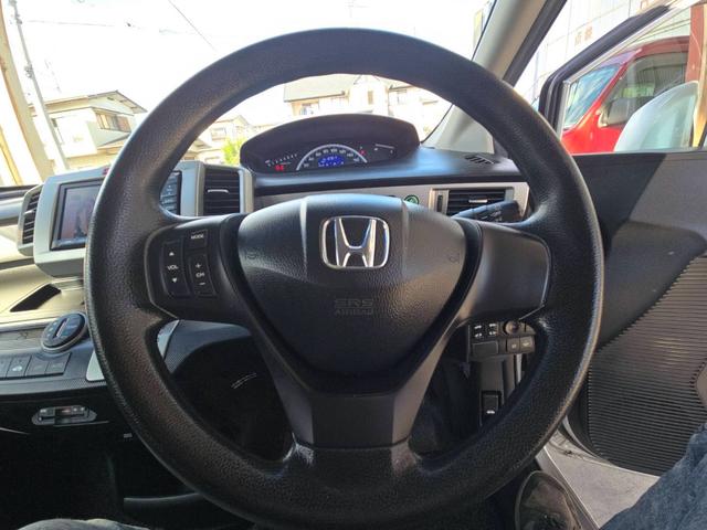 フリード フレックスｉ　エアロ　両側パワースライドドア　ナビ　フルセグＴＶ　バックカメラ　ＥＴＣ　電動格納ミラー　スマートキー　オートエアコン　ドアバイザー　アルミホイール　フリップダウンモニター（9枚目）