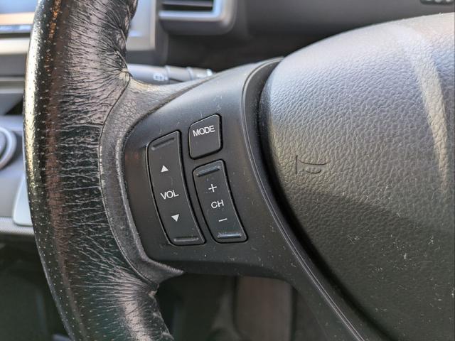 フリード Ｇ　ジャストセレクション　７人乗り／左側パワスラ／純正ナビ／キーレス／バックカメラ／ＥＴＣ／ステアリングリモコン／ＨＩＤライト／オートライト／本革巻きステアリング／タイミングチェーン／禁煙車／取説／保証書／スペアキー（21枚目）