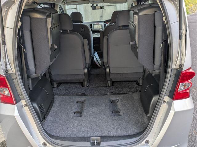 フリード Ｇ　ジャストセレクション　７人乗り／左側パワスラ／純正ナビ／キーレス／バックカメラ／ＥＴＣ／ステアリングリモコン／ＨＩＤライト／オートライト／本革巻きステアリング／タイミングチェーン／禁煙車／取説／保証書／スペアキー（48枚目）