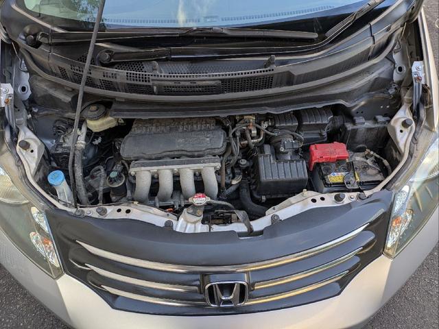 フリード Ｇ　ジャストセレクション　７人乗り／左側パワスラ／純正ナビ／キーレス／バックカメラ／ＥＴＣ／ステアリングリモコン／ＨＩＤライト／オートライト／本革巻きステアリング／タイミングチェーン／禁煙車／取説／保証書／スペアキー（59枚目）