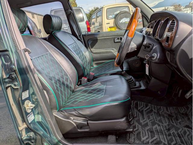 ミラジーノ ミニライトスペシャルターボ　社外ナビ　ＨＩＤヘッドライト　ローダウン　５速ミッション　社外スピーカー　ウッドコンビハンドル　フェンダーミラー　シートカバー　前後ドライブレコーダー　ＥＴＣ　ユーザー買取車　禁煙車（11枚目）