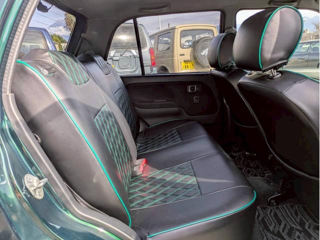 ミラジーノ ミニライトスペシャルターボ　社外ナビ　ＨＩＤヘッドライト　ローダウン　５速ミッション　社外スピーカー　ウッドコンビハンドル　フェンダーミラー　シートカバー　前後ドライブレコーダー　ＥＴＣ　ユーザー買取車　禁煙車（13枚目）