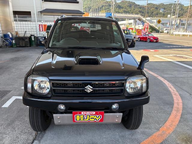 ジムニー ワイルドウインド　リフトアップ　４ＷＤ　前後ドライブレコーダー　Ｂｌｕｅｔｏｏｔｈ接続　社外マフラー　ナビ　ＴＶ　キーレスエントリー　電動格納ミラー　シートヒーター　ＭＴ　ルーフレール　アルミホイール　衝突安全ボディ（12枚目）