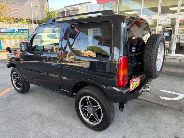 ジムニー ワイルドウインド　リフトアップ　４ＷＤ　前後ドライブレコーダー　Ｂｌｕｅｔｏｏｔｈ接続　社外マフラー　ナビ　ＴＶ　キーレスエントリー　電動格納ミラー　シートヒーター　ＭＴ　ルーフレール　アルミホイール　衝突安全ボディ（17枚目）