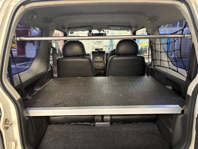 ジムニー ＸＧ　リフトアップ　Ｂｌｕｅｔｏｏｔｈ接続　社外マフラー　４ＷＤ　ドライブレコーダー　キーレスエントリー　電動格納ミラー　ＭＴ　ＡＢＳ　社外アルミホイール　衝突安全ボディ　エアコン　パワーウィンドウ（18枚目）