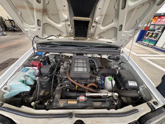 ジムニー ＸＧ　リフトアップ　Ｂｌｕｅｔｏｏｔｈ接続　社外マフラー　４ＷＤ　ドライブレコーダー　キーレスエントリー　電動格納ミラー　ＭＴ　ＡＢＳ　社外アルミホイール　衝突安全ボディ　エアコン　パワーウィンドウ（19枚目）