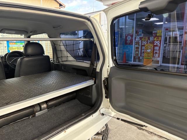 ジムニー ＸＧ　リフトアップ　Ｂｌｕｅｔｏｏｔｈ接続　社外マフラー　４ＷＤ　ドライブレコーダー　キーレスエントリー　電動格納ミラー　ＭＴ　ＡＢＳ　社外アルミホイール　衝突安全ボディ　エアコン　パワーウィンドウ（26枚目）