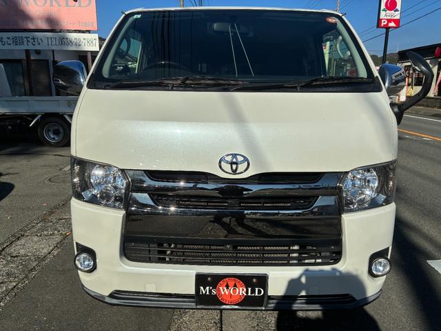 ハイエースバン スーパーGL ダークプライム ダークプライム 4WD LEDヘッドライト ウッドコンビステアリング 電動格納ミラー ドアバイザー ハーフレザーシート Bカメラ Wエアコン ETC 助手席エアバック スマートキー ナビ TV(2枚目)