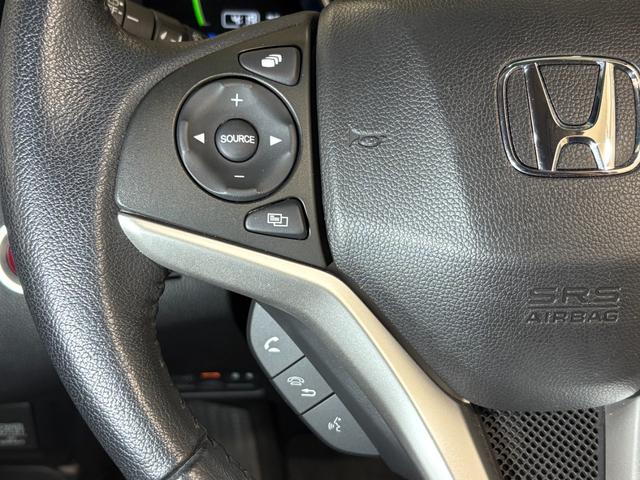 フィットハイブリッド Ｌパッケージ　ナビフルセグＢカメラＥＴＣＬＥＤＡＷ　ナビ＆ＴＶ　地デジフルセグＴＶ　ＵＳＢ　ＤＶＤ再生　バックカメラ　オートクルーズコントロール　ＥＳＣ　ＡＵＴＯエアコン　ＡＢＳ　運転席助手席エアバッグ　キーフリー（22枚目）