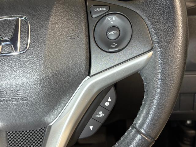 フィットハイブリッド Ｌパッケージ　ナビフルセグＢカメラＥＴＣＬＥＤＡＷ　ナビ＆ＴＶ　地デジフルセグＴＶ　ＵＳＢ　ＤＶＤ再生　バックカメラ　オートクルーズコントロール　ＥＳＣ　ＡＵＴＯエアコン　ＡＢＳ　運転席助手席エアバッグ　キーフリー（23枚目）