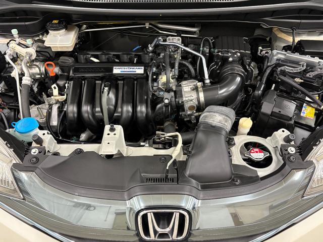 フィットハイブリッド Ｌパッケージ　ナビフルセグＢカメラＥＴＣＬＥＤＡＷ　ナビ＆ＴＶ　地デジフルセグＴＶ　ＵＳＢ　ＤＶＤ再生　バックカメラ　オートクルーズコントロール　ＥＳＣ　ＡＵＴＯエアコン　ＡＢＳ　運転席助手席エアバッグ　キーフリー（34枚目）