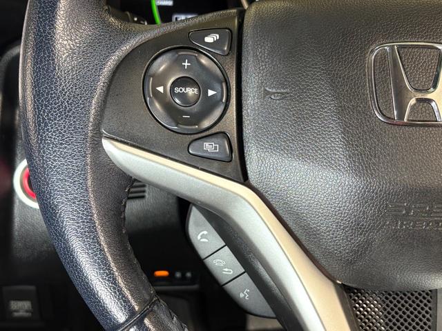 フィットハイブリッド Ｌホンダセンシング　ナビフルセグＢカメラＥＴＣＬＥＤ　軽減ブレーキ　Ｒカメ　サイドＳＲＳ　横滑り防止　ドライブレコーダー　フルセグテレビ　ナビＴＶ　パワーステアリング　オートクルーズ　ＥＴＣ車載器　ＤＶＤ再生　ＡＢＳ（23枚目）