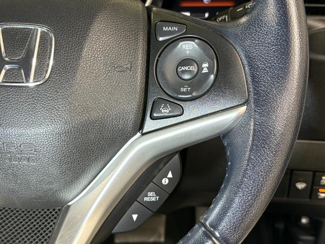 フィットハイブリッド Ｌホンダセンシング　ナビフルセグＢカメラＥＴＣＬＥＤ　軽減ブレーキ　Ｒカメ　サイドＳＲＳ　横滑り防止　ドライブレコーダー　フルセグテレビ　ナビＴＶ　パワーステアリング　オートクルーズ　ＥＴＣ車載器　ＤＶＤ再生　ＡＢＳ（24枚目）