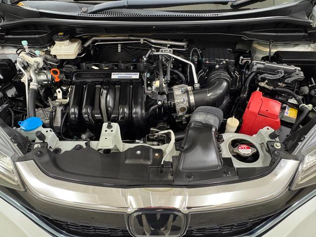 フィットハイブリッド Ｌホンダセンシング　ナビフルセグＢカメラＥＴＣＬＥＤ　軽減ブレーキ　Ｒカメ　サイドＳＲＳ　横滑り防止　ドライブレコーダー　フルセグテレビ　ナビＴＶ　パワーステアリング　オートクルーズ　ＥＴＣ車載器　ＤＶＤ再生　ＡＢＳ（36枚目）