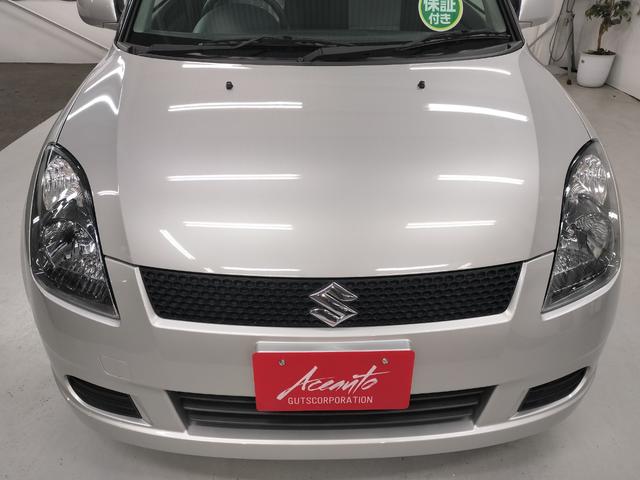 スイフト １．３ＸＧ　リミテッド　禁煙車　特別仕様車　５速マニュアルミッション　本革巻きステアリング　スマートキー　オートエアコン　社外シフトノブ　純正フロアマット　純正ドアバイザー　Ｗエアバッグ　ＡＢＳ　ヘアラインアルミ調オーディオ（20枚目）