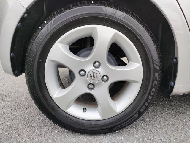 スイフト １．３ＸＧ　リミテッド　禁煙車　特別仕様車　５速マニュアルミッション　本革巻きステアリング　スマートキー　オートエアコン　社外シフトノブ　純正フロアマット　純正ドアバイザー　Ｗエアバッグ　ＡＢＳ　ヘアラインアルミ調オーディオ（58枚目）