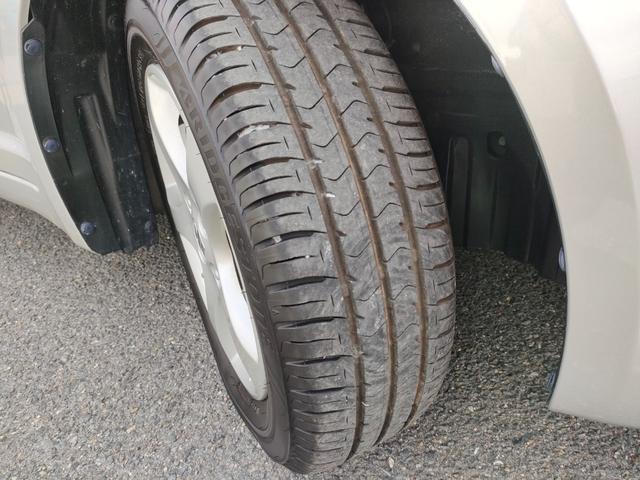 スイフト １．３ＸＧ　リミテッド　禁煙車　特別仕様車　５速マニュアルミッション　本革巻きステアリング　スマートキー　オートエアコン　社外シフトノブ　純正フロアマット　純正ドアバイザー　Ｗエアバッグ　ＡＢＳ　ヘアラインアルミ調オーディオ（62枚目）