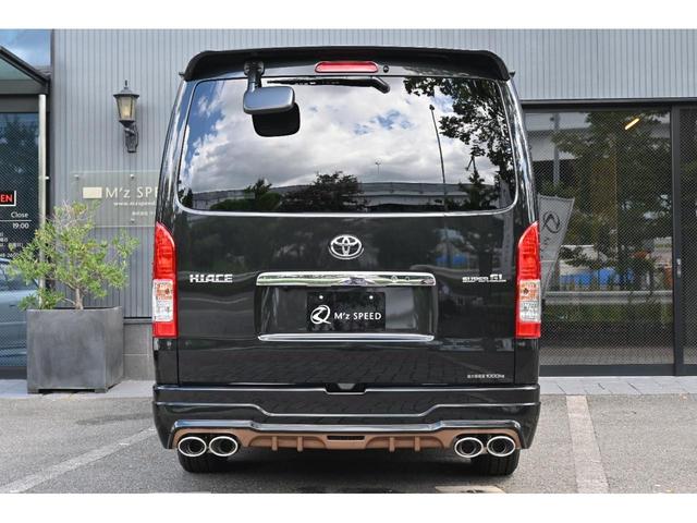 ロングスーパーGL ZEUS新車カスタムコンプリートカー・エアロ3点・リアウィング・17インチ・4本出マフラー・両側電動・固定式リアサイドガラス・LEDヘッドランプ・アルパインナビ・ETC・バックカメラ(8枚目)