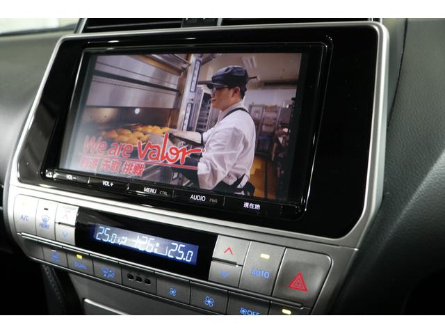 ランドクルーザープラド ＴＸ　ガナドールマフラー／ＷＯＲＫ／９インチナビ／ブロックタイヤ（グッドリッチ）／パークセンサー／スペアタイヤ／ＥＴＣ／ウッドコンビハンドル／ＢＡＴＴＬＥＺ　ＳＰＲＩＮＧ（リフトアップ）／ディーラー記録簿（25枚目）