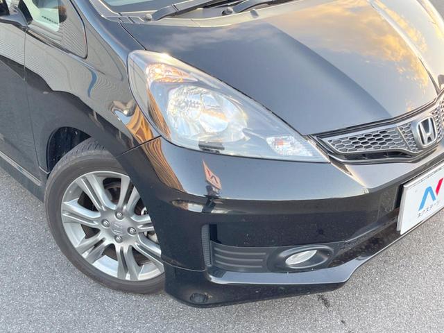 フィット RS 純正ナビ バックカメラ ETC HIDヘッドライト 純正16インチアルミホイール パドルシフト リモコンキー 革巻きステアリング バニティミラー セキュリティアラーム(12枚目)