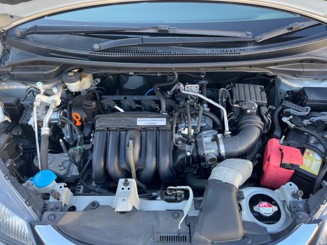 フィット １３Ｇ・Ｆパッケージ　禁煙車　純正ナビ　バックカメラ　アイドリングストップ　電動格納ミラー　スマートキー　ヘッドレベライザー　ステアリングリモコン　セキュリティアラーム（17枚目）