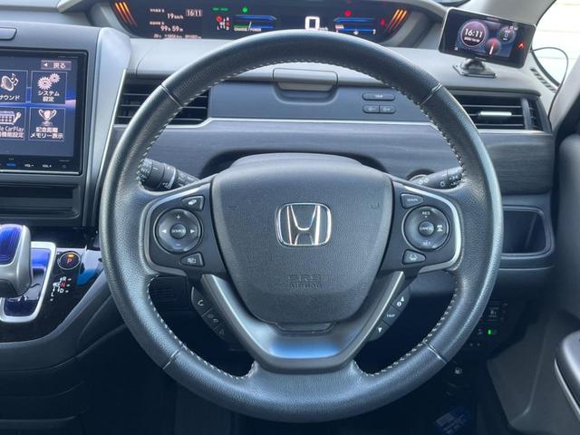 フリードハイブリッド ハイブリッド・Ｇホンダセンシング　後席モニター　バックカメラ　衝突被害軽減システム　レーダークルーズ　ハーフレザーシート　スマートキー　ＬＥＤヘッド　ビルトインＥＴＣ　オートライト　オートエアコン　ＣＤ　ＤＶＤ再生（12枚目）