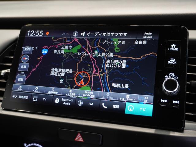 フィット ｅ：ＨＥＶホーム　当社デモカー　純正メモリーナビ　ホンダセンシング　ＬＥＤヘッドライト　オートハイビーム　ＥＴＣ　ドライブレコーダー　ＵＳＢ　スマートキー　両席エアバック　カーテンエアバック　サイドエアバッグ（2枚目）
