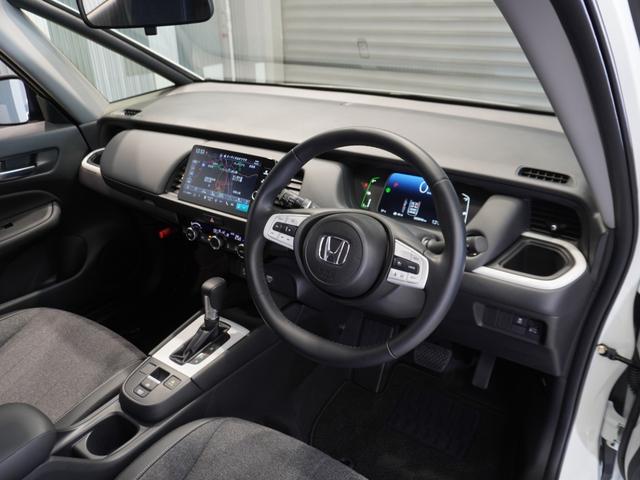 フィット ｅ：ＨＥＶホーム　当社デモカー　純正メモリーナビ　ホンダセンシング　ＬＥＤヘッドライト　オートハイビーム　ＥＴＣ　ドライブレコーダー　ＵＳＢ　スマートキー　両席エアバック　カーテンエアバック　サイドエアバッグ（35枚目）