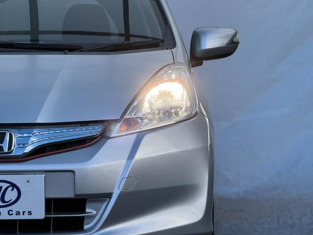 フィットハイブリッド ナビプレミアムセレクション　弊社買取車両　故障診断済　純正ＨＤＤナビ／ワンセグ／ＤＶＤ再生／録音／ＵＳＢ　Ｂカメラ　ビルトインＥＴＣ　前後ドラレコ　パドルシフト　前席シートヒーター　クルコン　ＨＩＤヘッドライト　雹害車（20枚目）