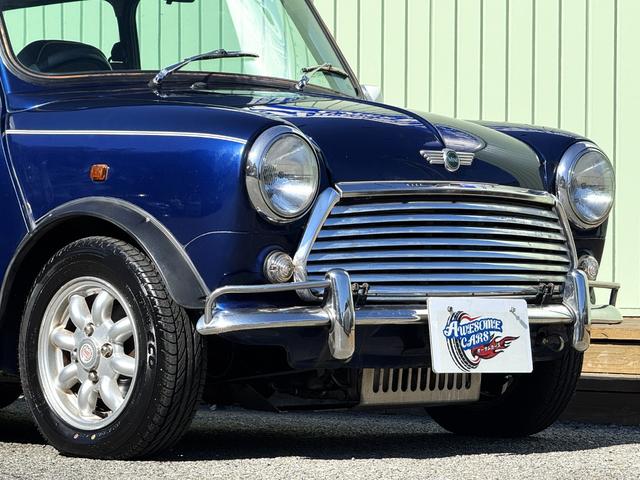 MINI クーパー /禁煙車/革シート/エアコン動作確認/天張り垂れ無し/ETC/12インチクーパーホイール/革巻きステアリング/ウッド調パネル/(17枚目)