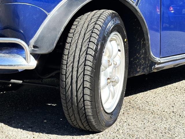 MINI クーパー /禁煙車/革シート/エアコン動作確認/天張り垂れ無し/ETC/12インチクーパーホイール/革巻きステアリング/ウッド調パネル/(35枚目)