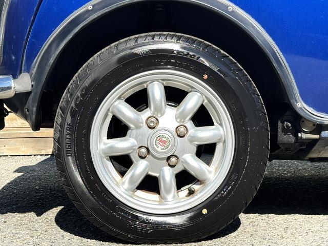 MINI クーパー /禁煙車/革シート/エアコン動作確認/天張り垂れ無し/ETC/12インチクーパーホイール/革巻きステアリング/ウッド調パネル/(38枚目)