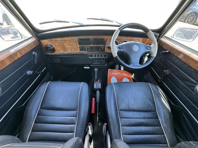 MINI クーパー /禁煙車/革シート/エアコン動作確認/天張り垂れ無し/ETC/12インチクーパーホイール/革巻きステアリング/ウッド調パネル/(47枚目)