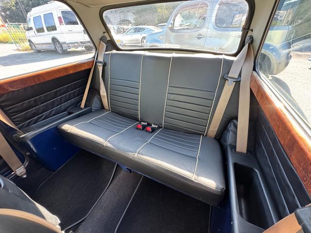 MINI クーパー /禁煙車/革シート/エアコン動作確認/天張り垂れ無し/ETC/12インチクーパーホイール/革巻きステアリング/ウッド調パネル/(69枚目)