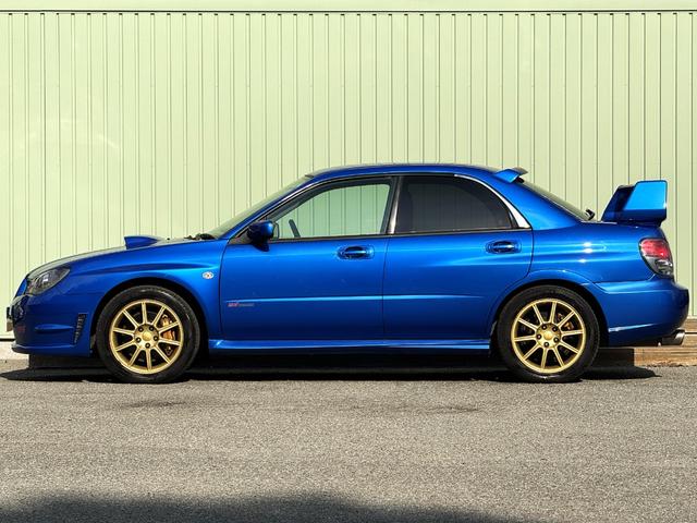 インプレッサ WRX STi /6MT/EJ20/大型リアウイング/HIDヘッドライト/DCCD/17インチホイール/革巻きSTIステアリング/キーレスエントリー/オーディオ/AUX/(14枚目)