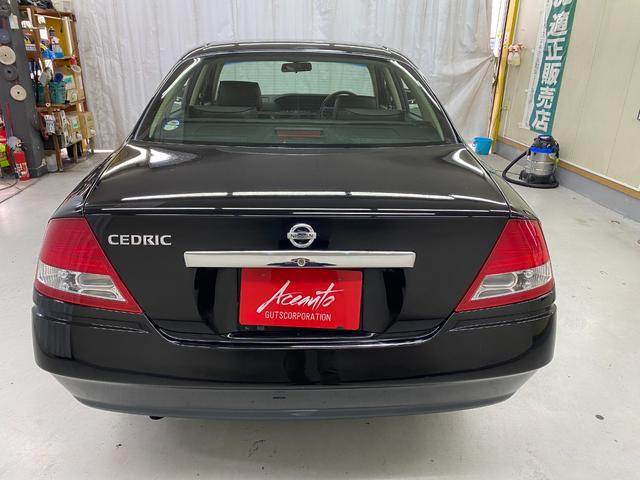 セドリック ２５０Ｌナビエディション７０ｔｈＩＩ本革パック　ブラックレザーシート　パワーシート　キセノンヘッドライト　純正ナビ　アルミホイール　オートライト　キーレス（34枚目）