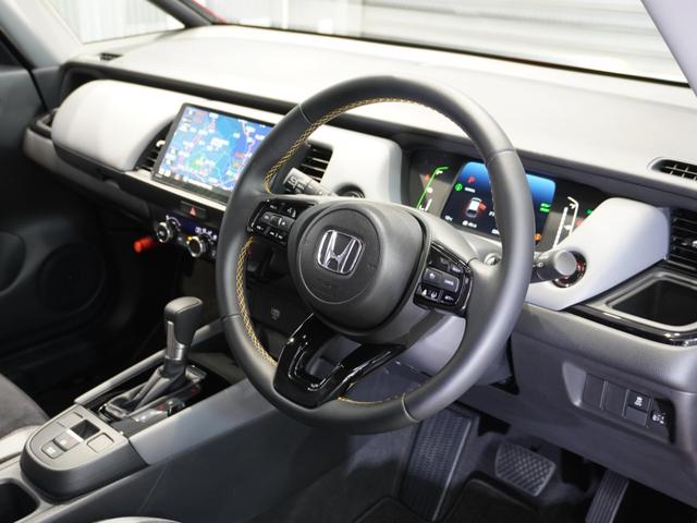 フィット ｅ：ＨＥＶＲＳ　当社デモカー　禁煙車　９インチギャザーズメモリーナビ　フルセグ　ＣＤ／ＤＶＤ　ミュージックラック　ホンダセンシング　ＬＥＤヘッドライト　ＥＴＣ　ドライブレコーダー　前後センサー１６インチアルミホイール（33枚目）